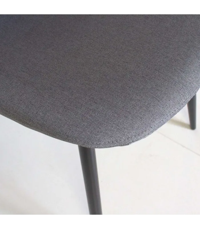 Pack de 4 sillas modernas tapizadas en gris.